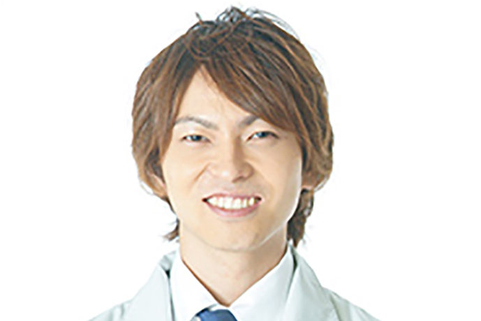 作業着を着た笑顔の男性